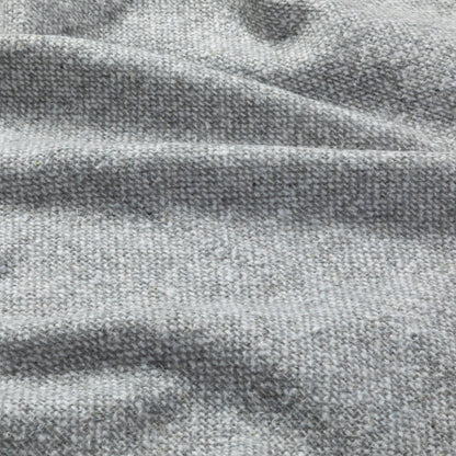 Close-up of soft, textured gray fabric with subtle variations in color.