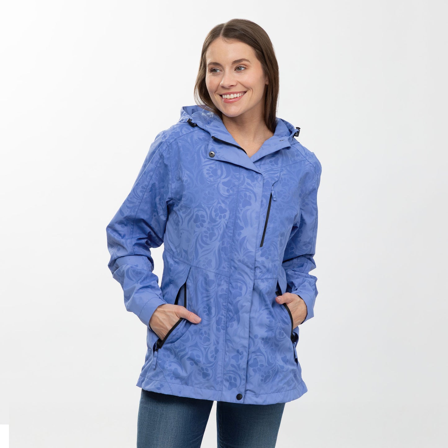 Woman wearing a periwinkle paw print patterned raincoat on a white background