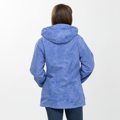 Person wearing a periwinkle paw patterned raincoat on a white background