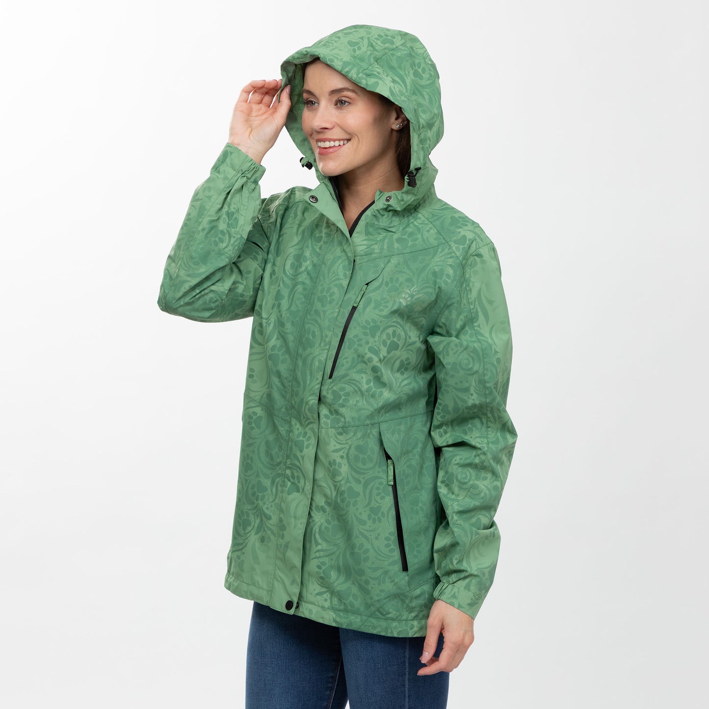 Woman wearing a green raincoat on a white background