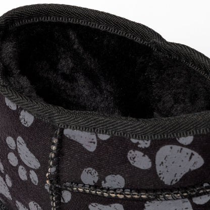 Close-up of a black slipper with paw print pattern and soft interior