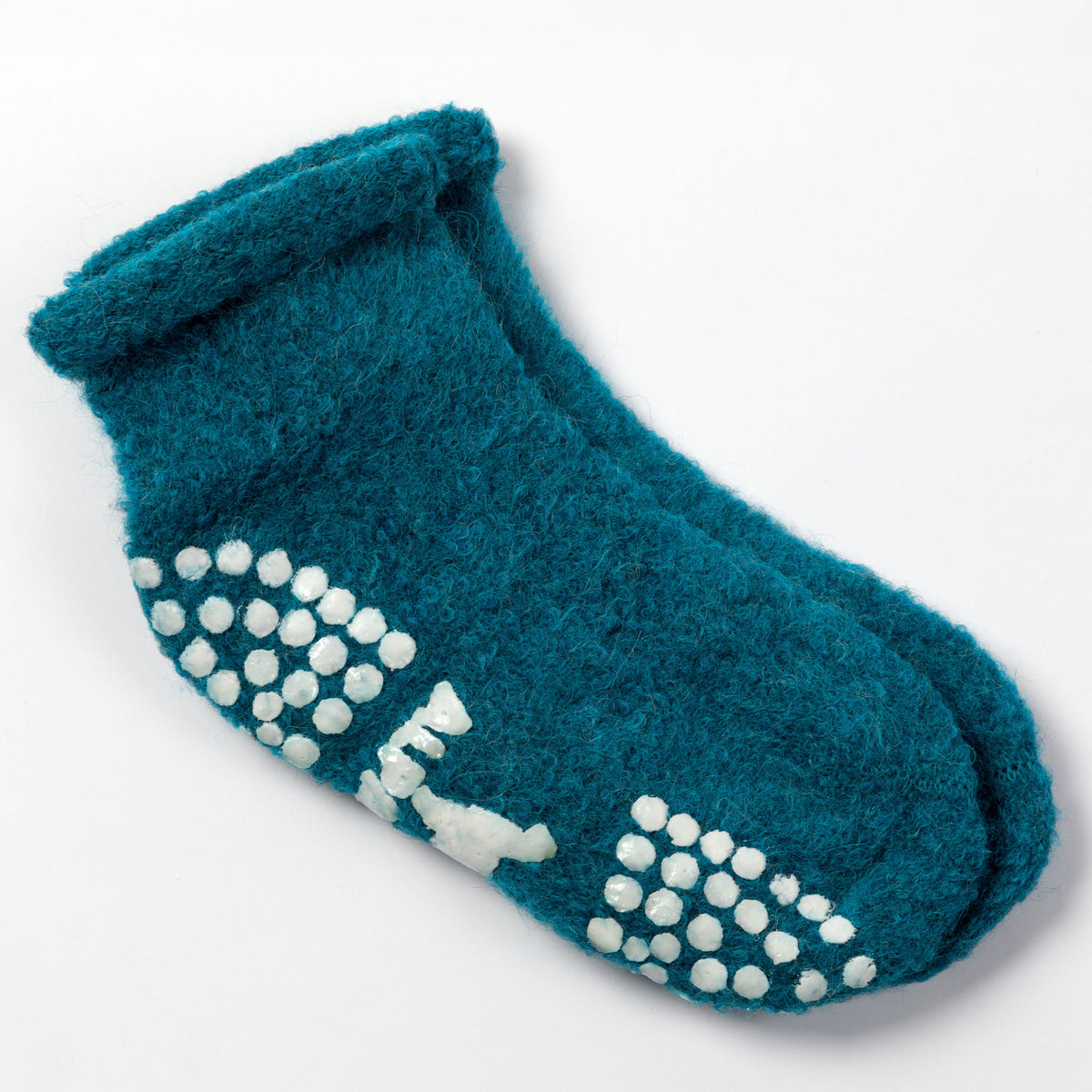 A single teal fleece ankle sock with white non-slip grip dots on the sole, photographed on a clean white background.