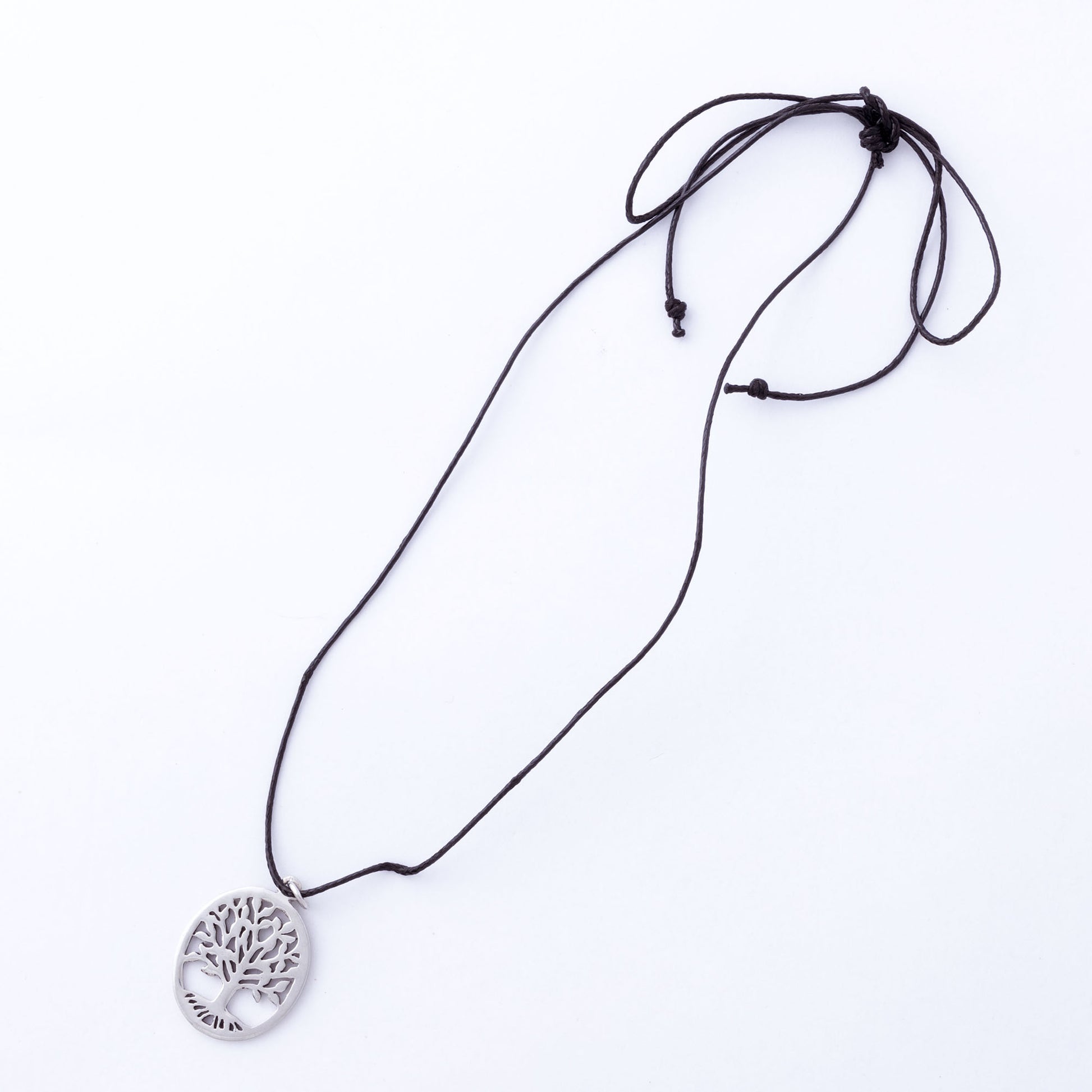 Necklace with a tree-of-life pendant on a white background