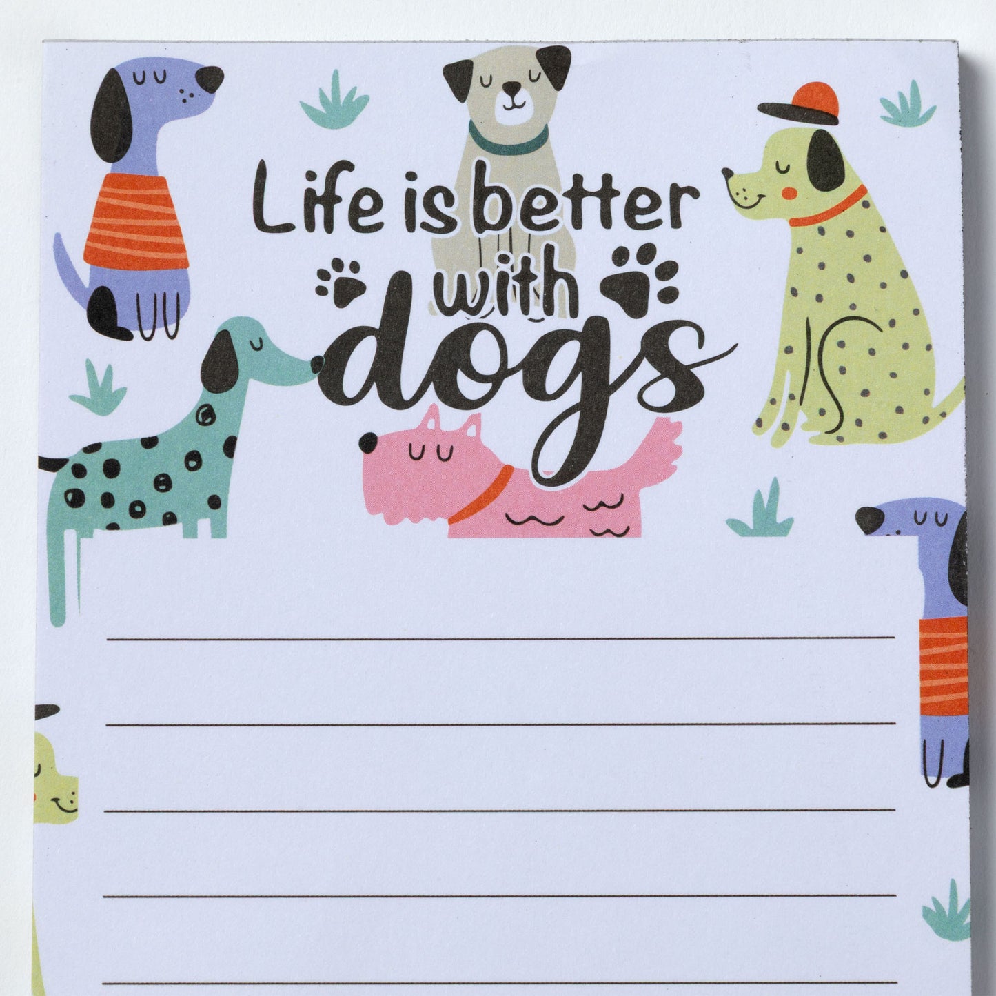 Notepad with cartoon dogs and 'Life is better with dogs' text on a white background.