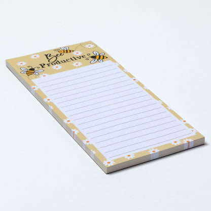 Light yellow notepad with bee design and the phrase "Bee productive" on a white background.