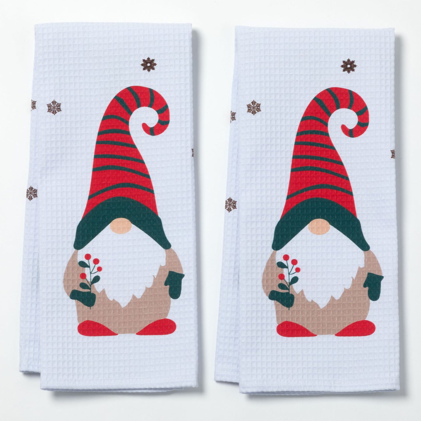 Two kitchen towels with Christmas gnome design on a white background
