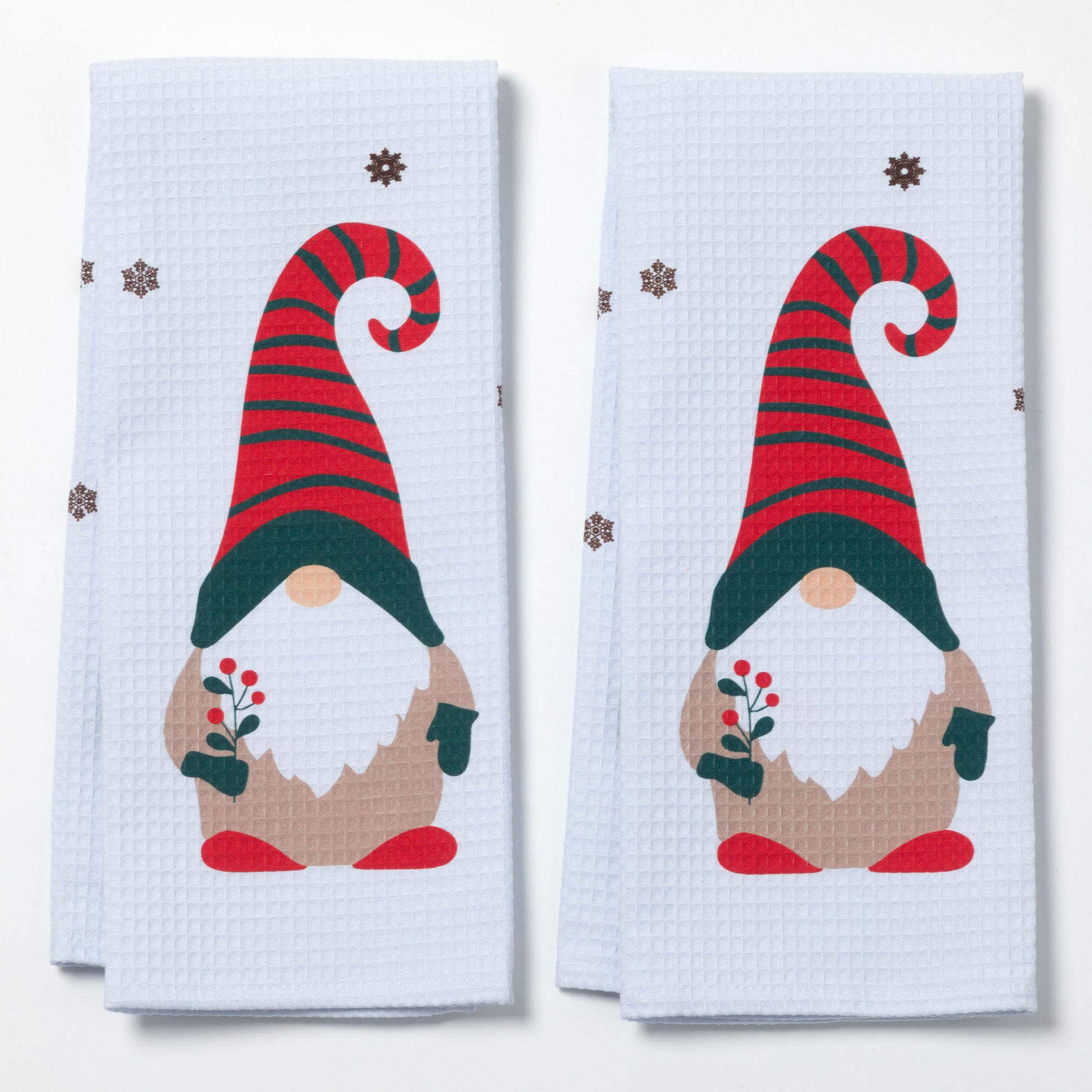 Two kitchen towels with Christmas gnome design on a white background