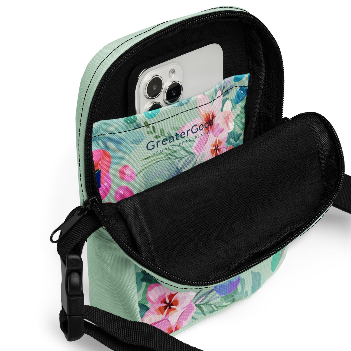 Floral-patterned crossbody bag with a phone inside on a white background