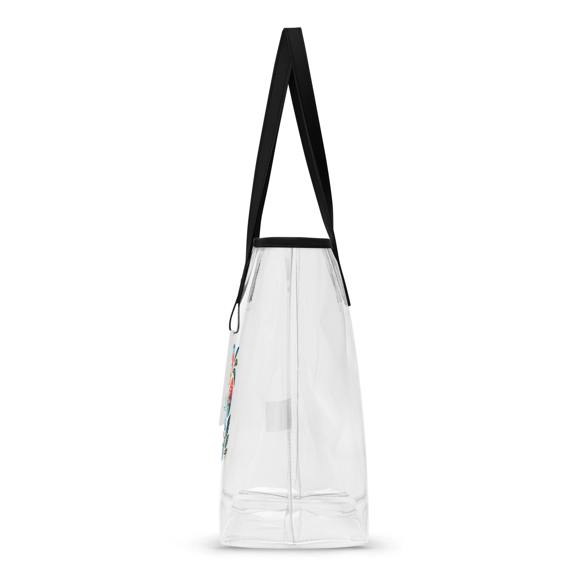 Side left view of a Hawaiian paw print design on a clear tote bag with black handles with a white background.