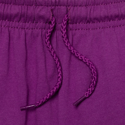 Close-up of a purple drawstring on a matching purple fabric on a pair of shorts