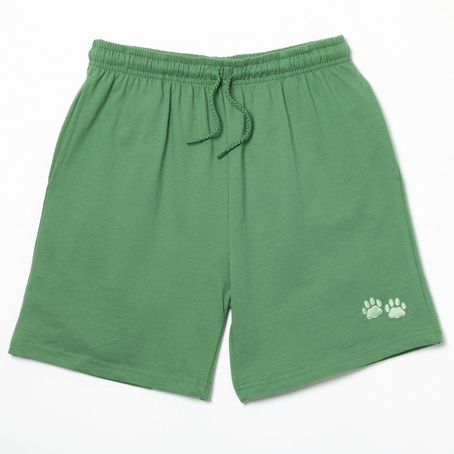 Green shorts with two light green embroidered paw prints on the left leg on a white background