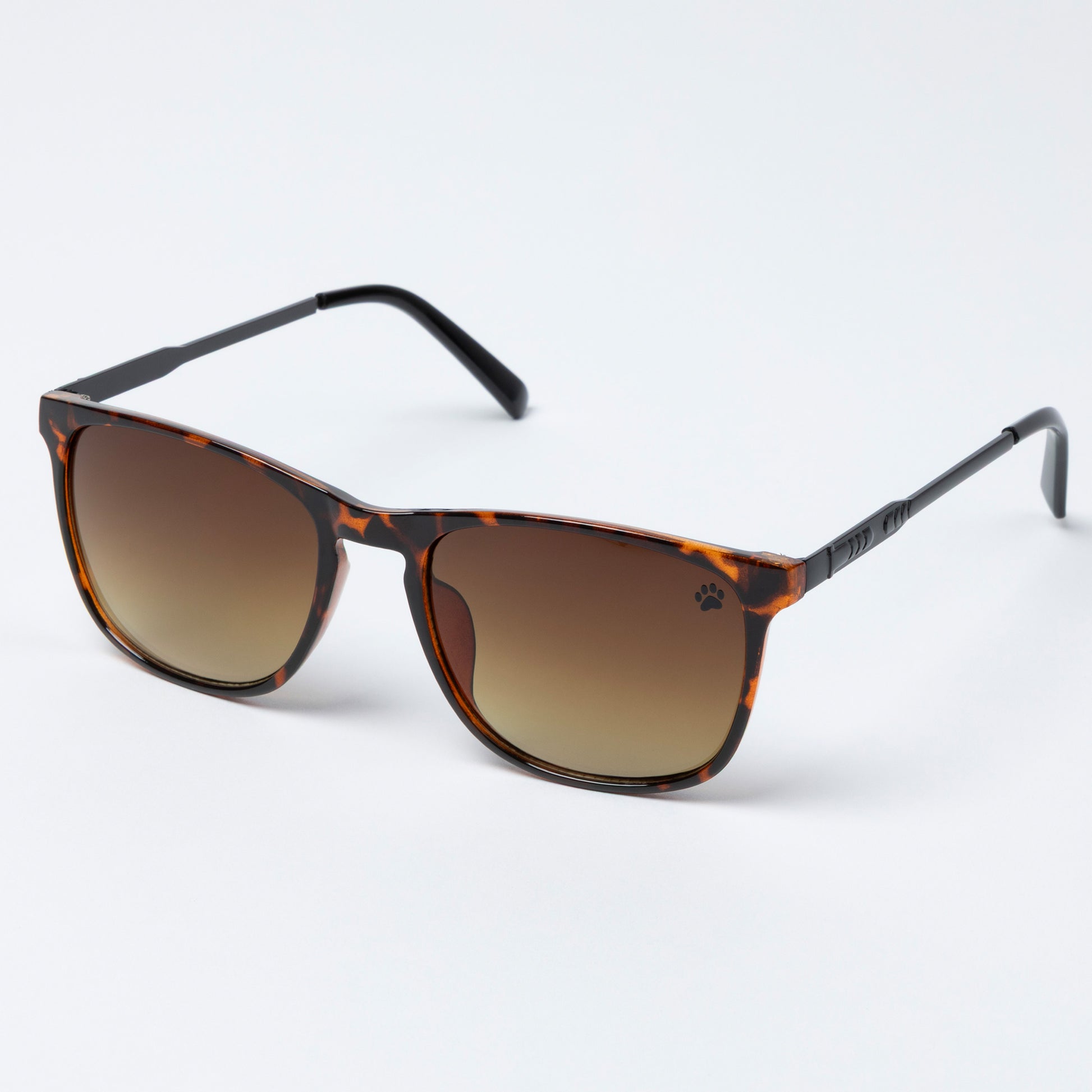 Sunglasses with tortoiseshell frame and brown gradient lenses on a white background