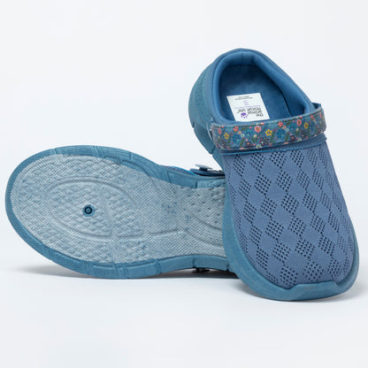 Blue clog shoes with a floral strap on a white background