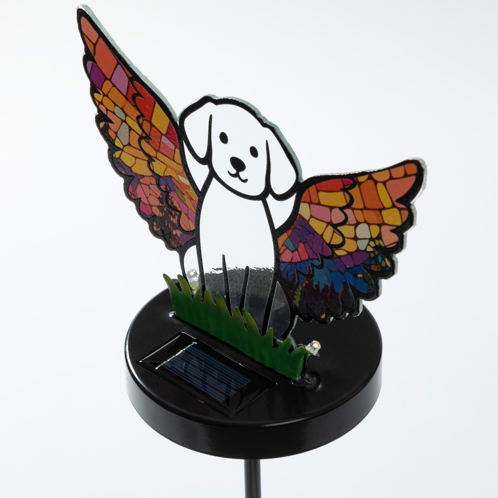 Dog silhouette with mosaic angel wings on a garden stake, against a white background.