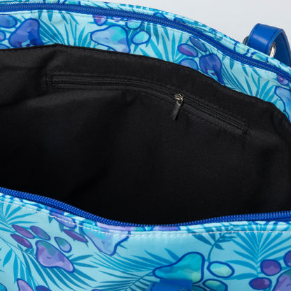 Blue paw print floral-patterned bag with a black interior
