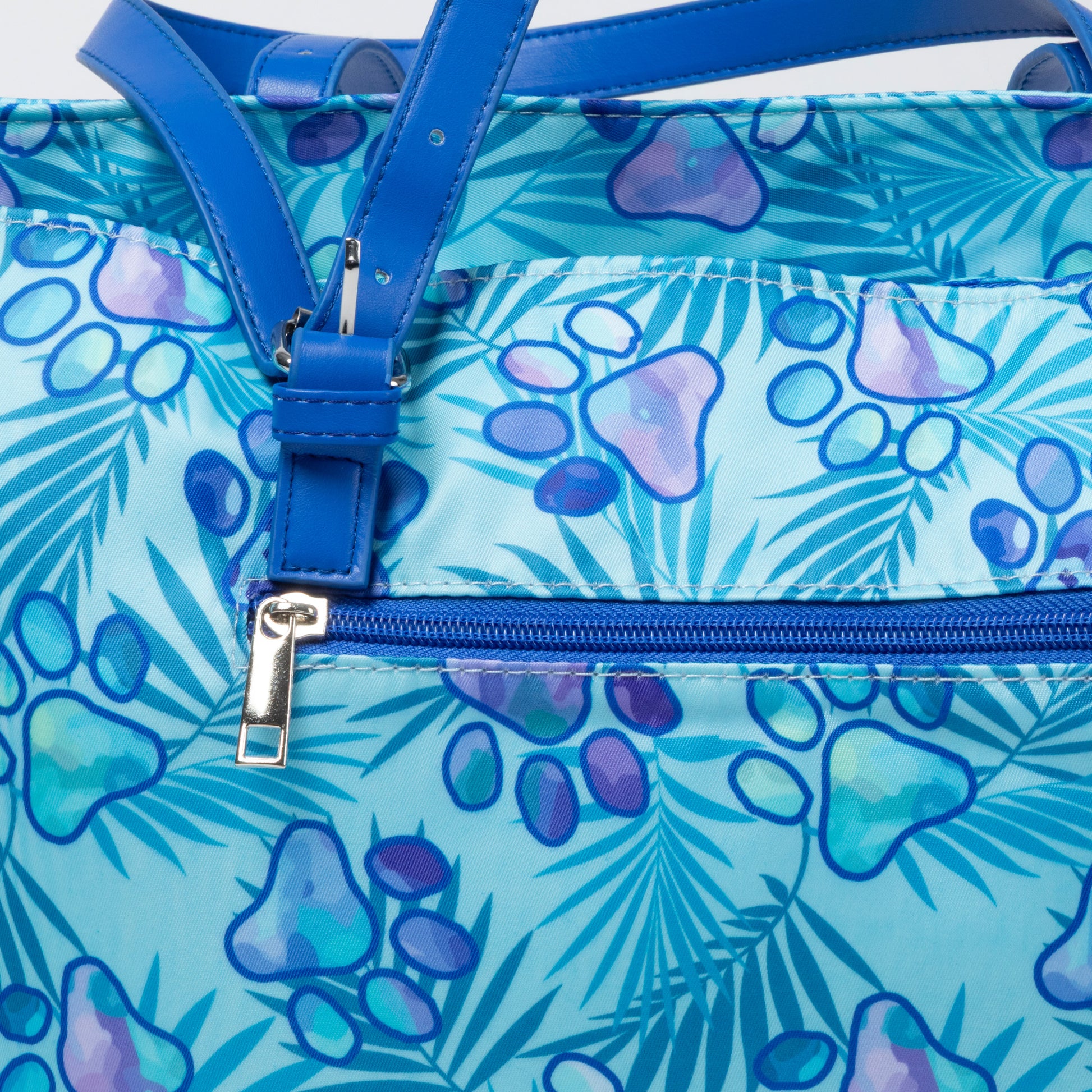 Blue bag with paw print pattern and zipper