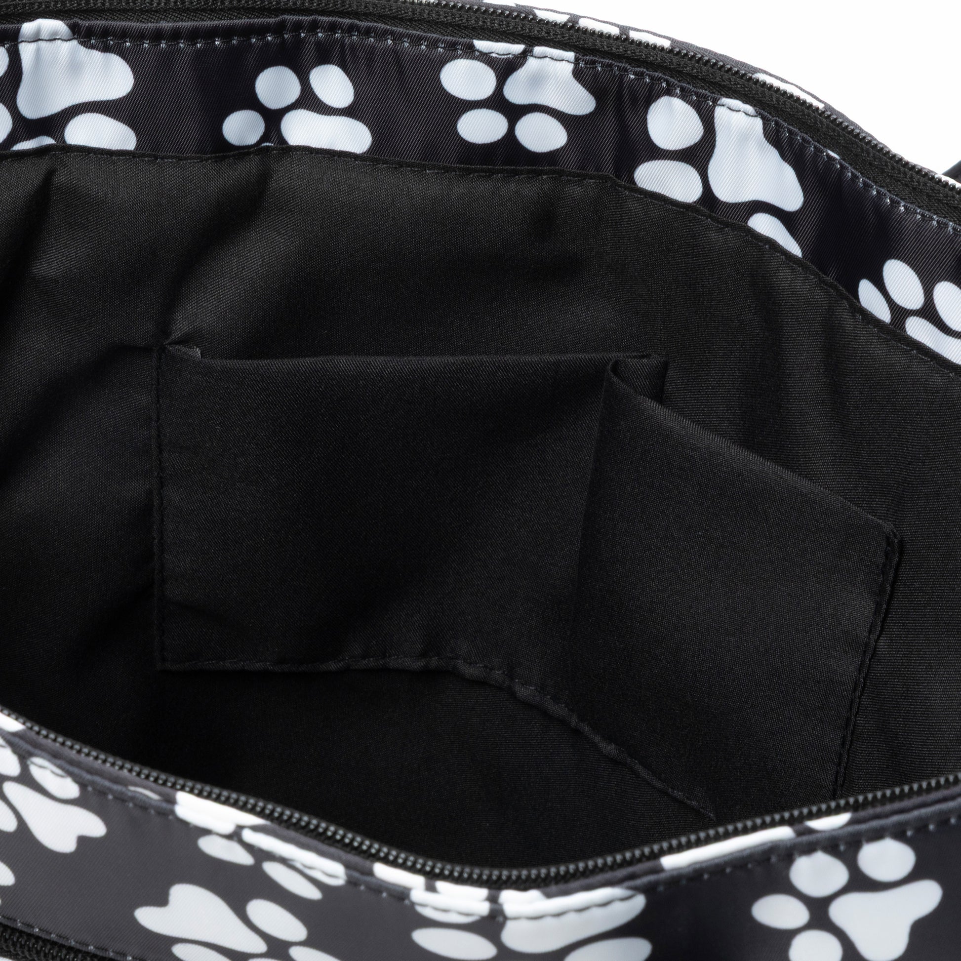 Black tote bag with white paw prints on a black background