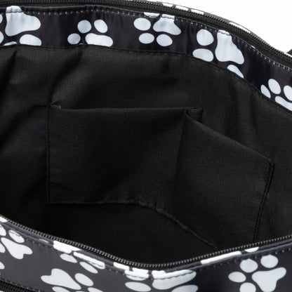 Black tote bag with white paw prints on a black background