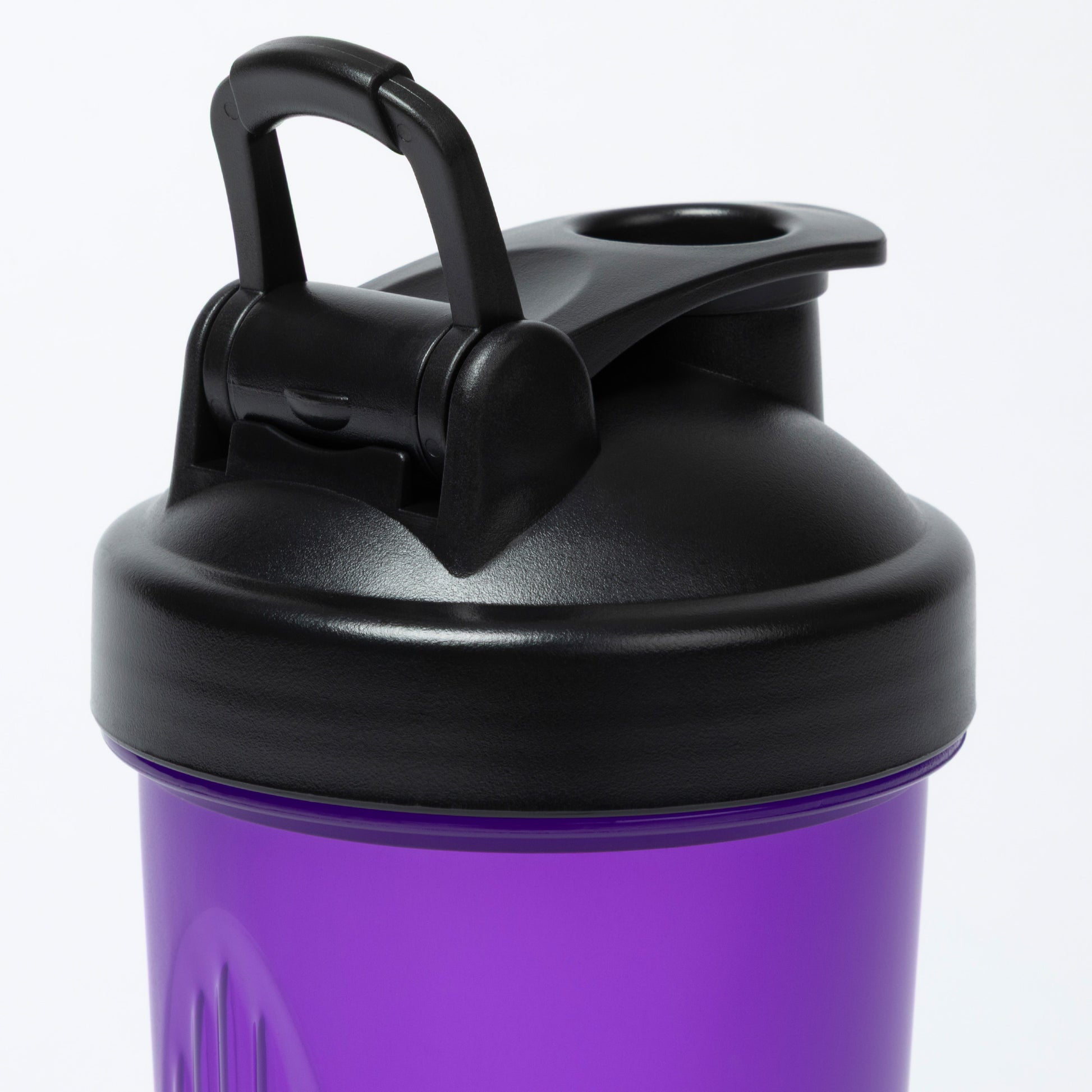 Purple shaker bottle with black lid on a white background