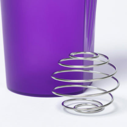 Metallic wire shaker ball with a purple tumbler in the background