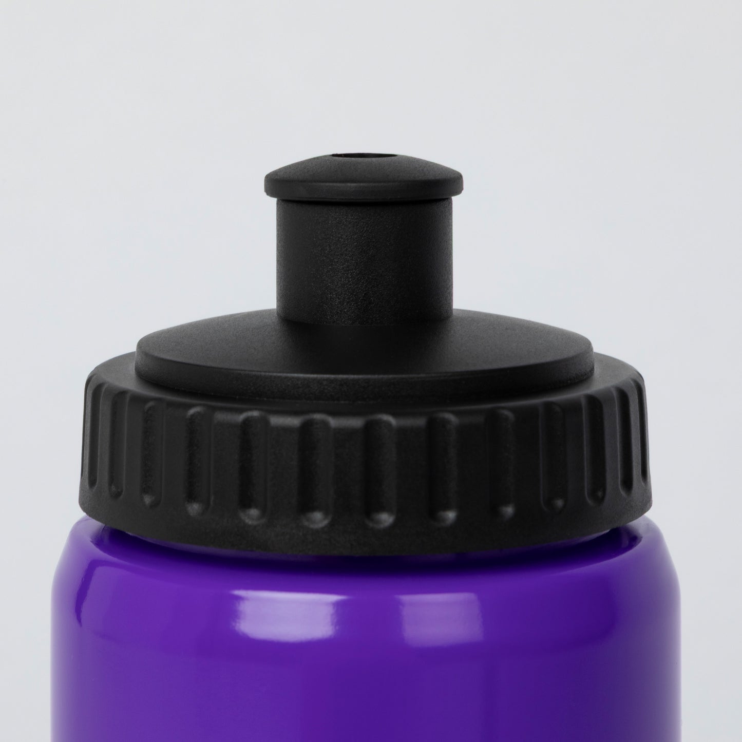 Close-up of a purple water bottle with a black screw-on cap and a black straw-style top insert, shown against a light gray background.