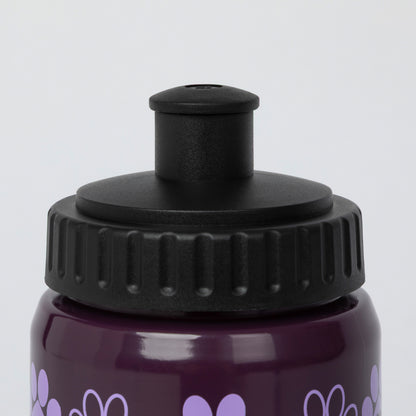 Close-up of a dark purple water bottle with a black flip-top lid and light purple heart pattern, shown against a light gray background.