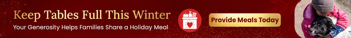 Keep Tables Full This Winter donation by The Animal Rescue Site and GreaterGood showing a child hugging a dog; supports meal assistance for families and pets in need.