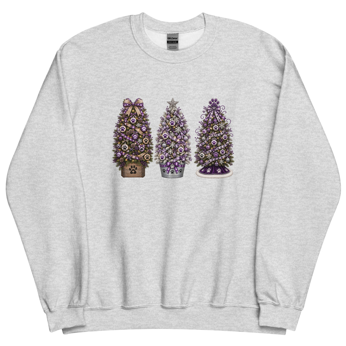A light heather gray crewneck sweatshirt featuring a graphic print of three decorated Christmas trees in the center. The left tree is brown with a purple bow, the middle tree is silver with a purple star, and the right tree is purple with a white base.