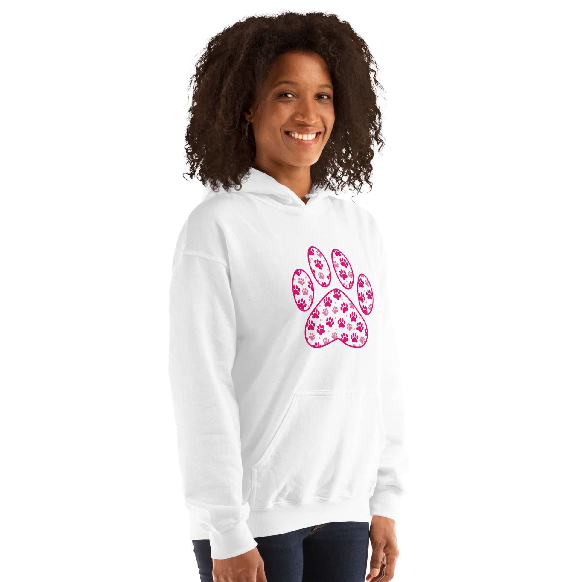 Paw Print in pink filled with mini pink paw prints on a white hoodie worn by a woman