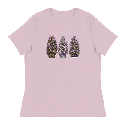 A light pink short-sleeve crewneck t-shirt featuring a graphic print of three decorated Christmas trees in the center, displayed on a clean white background.