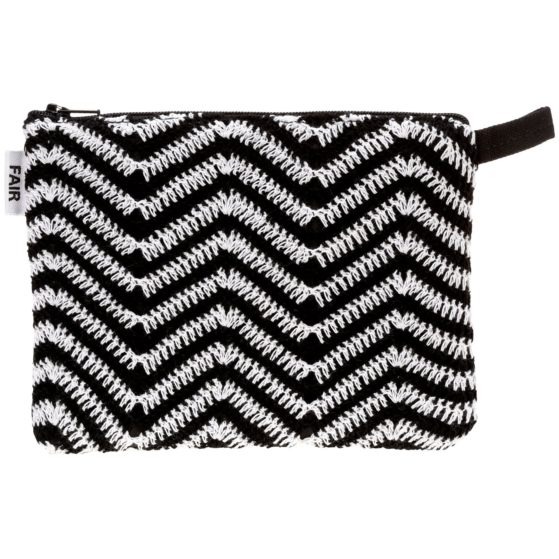 Black and white zigzag patterned pouch with a visible brand tag on a white background