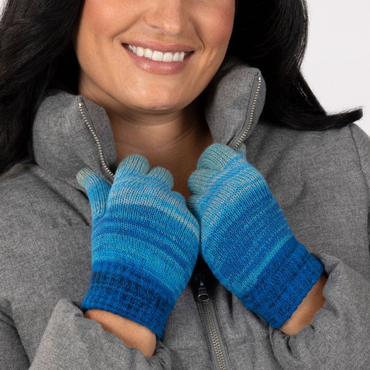 Woman in a gray jacket wearing blue Touch Screen Gloves, with a white background.