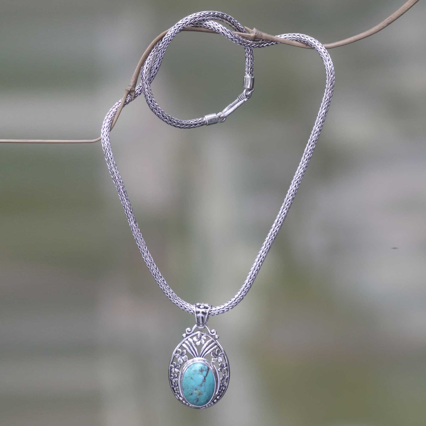 Frangipani Halo Sterling Silver Necklace with Turquoise Color Gem