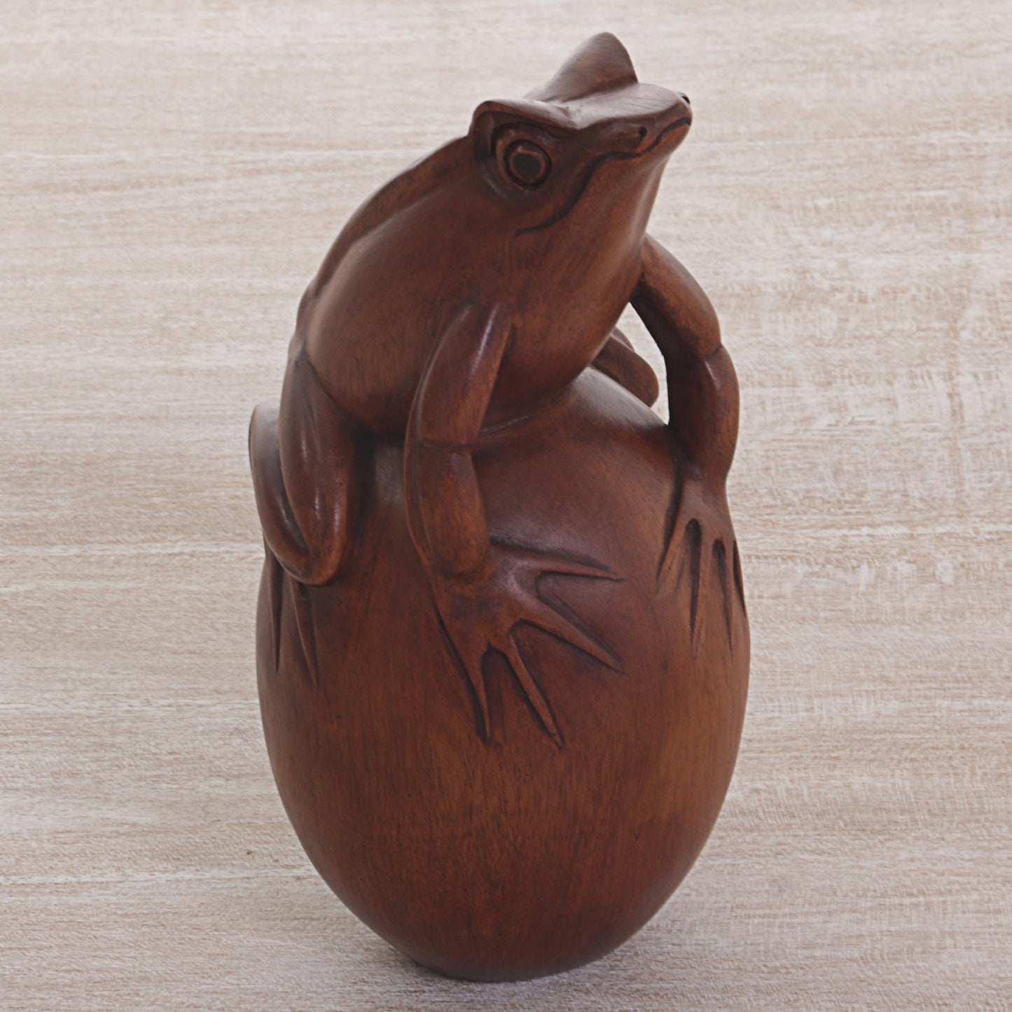 Proud Frog Hand Carved Suar Wood Frog on Pebble Sculpture