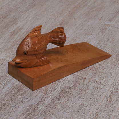 Helpful Goldfish in Brown Handcrafted Suar Wood Fish Doorstop in Brown from Bali