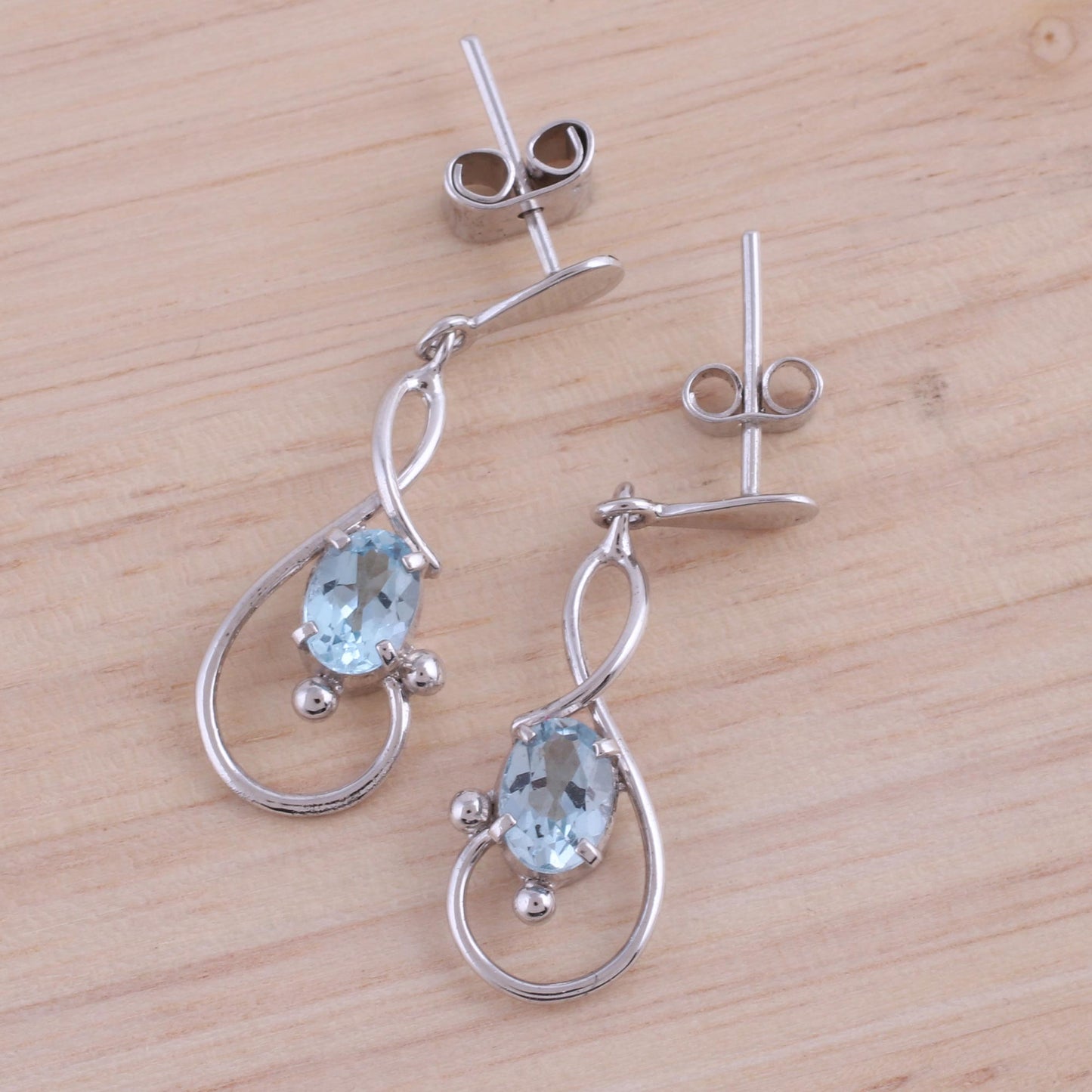 Beauty Swirls Rhodium Plated Blue Topaz Dangle Earrings from India