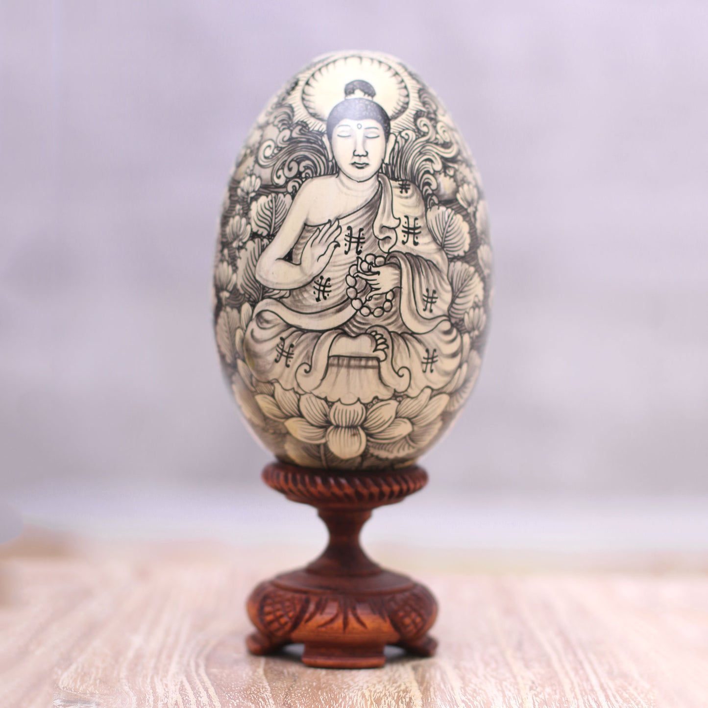 Deities Black on Cream Buddha and Ganesha Wood Egg Statuette