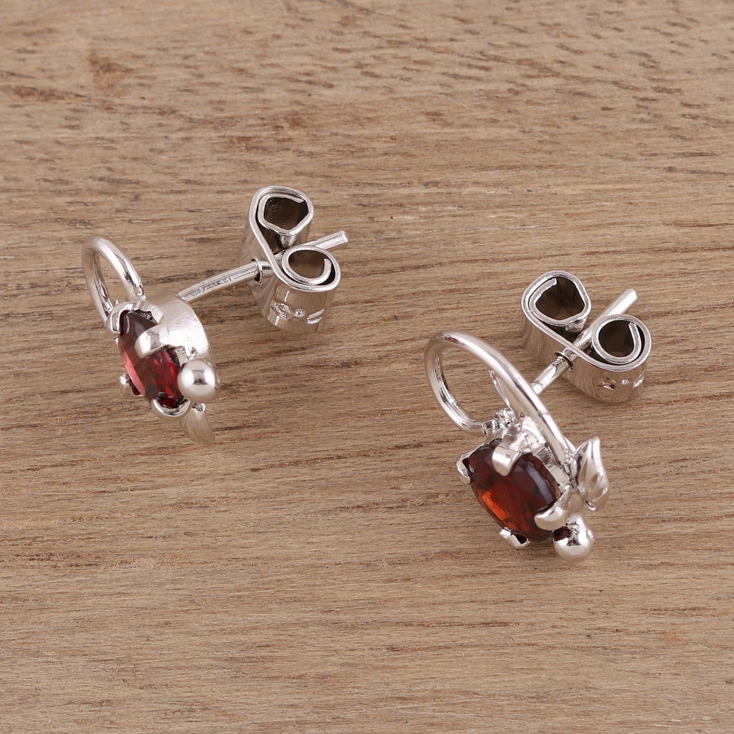 Blissful Radiance Leafy Rhodium Plated Garnet Stud Earrings from India