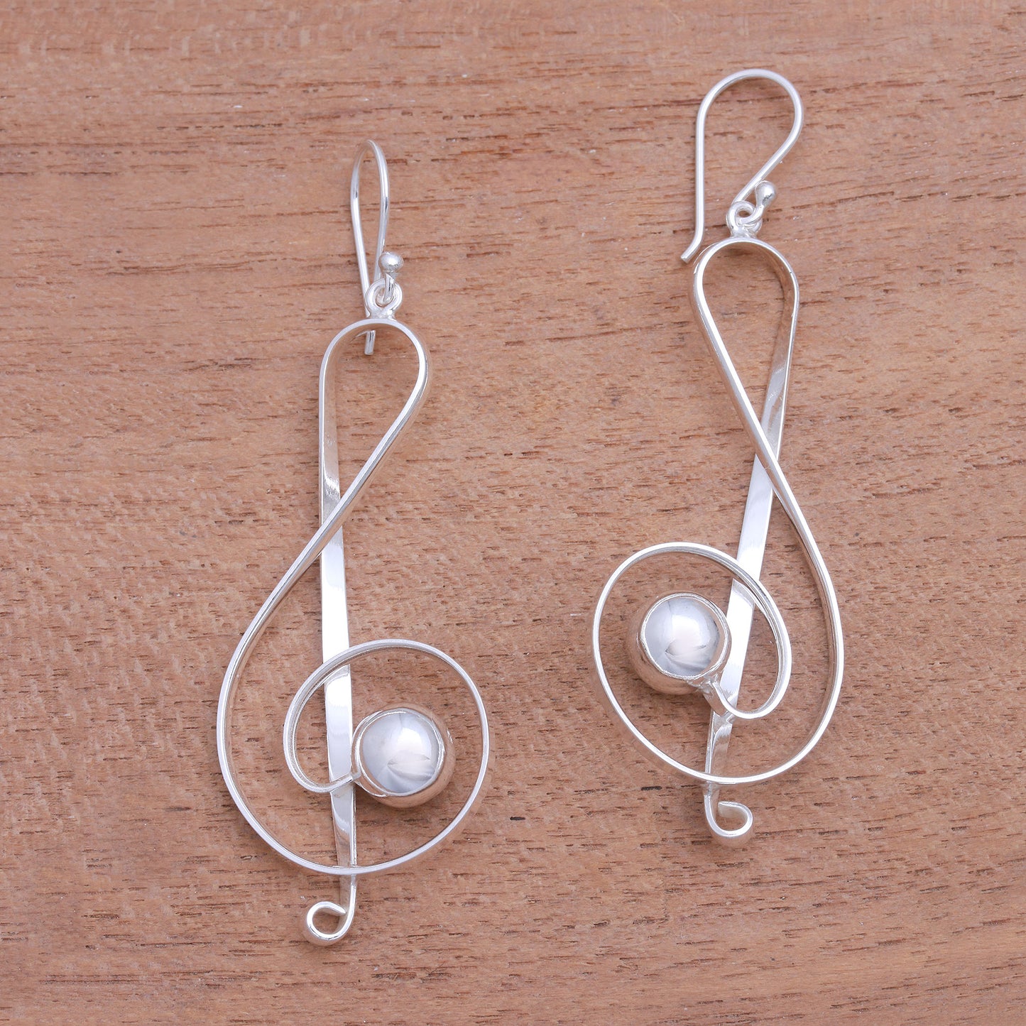 Gleaming Melody Sterling Silver Treble Clef Dangle Earrings from Bali