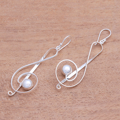 Gleaming Melody Sterling Silver Treble Clef Dangle Earrings from Bali