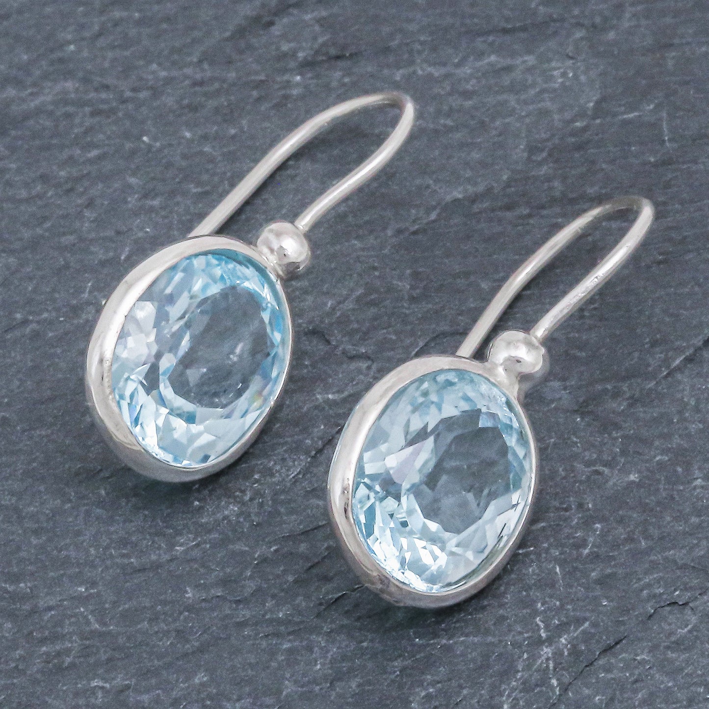 Noonday Sky Oval Faceted Blue Topaz Sterling Silver Dangle Earrings